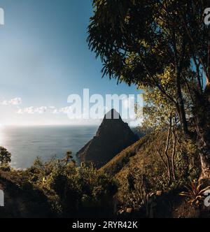 A view of the mountains from Petit and Gros Piton on St. Lucia in the Caribbean under blue skies. Photo taken near Soufriere. Stock Photo