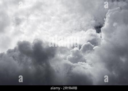 A small clearing reveals the blue sky between dark storm clouds in Lugo Galicia Stock Photo