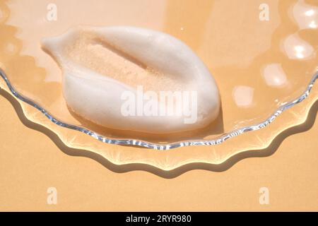 Soap foam on a light beige background. Stock Photo