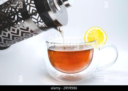 Black tea, pouring tea from tea pot in a white, - Stock Photo [98799334]  - PIXTA