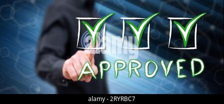 Man touching a validation concept on a touch screen with his finger Stock Photo