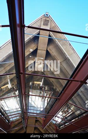 Interior view of the Sydney opera House looking out from Bennelong Restaurant up to the Concert hall sail, detail view with reflections on a sunny day Stock Photo