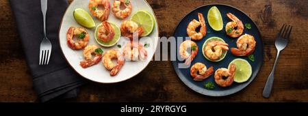 Shrimps panorama. Cooked shrimp, two plates, overhead flat lay shot Stock Photo