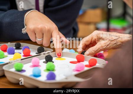 Rehabilitation center. Brain therapy cognitive psychological testing on senior patient. Alzheimer's disease and dementia prevent Stock Photo