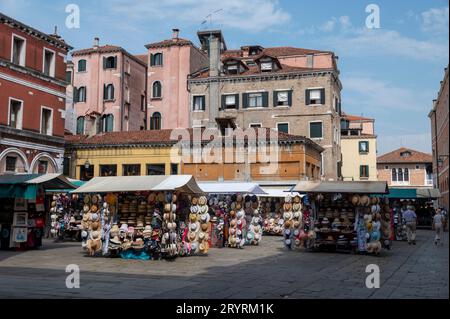 A general merchandise market on Campo de la Pescaria near the Rialto Bridge fish market in Venice in the Veneto region of northern Italy. Stock Photo