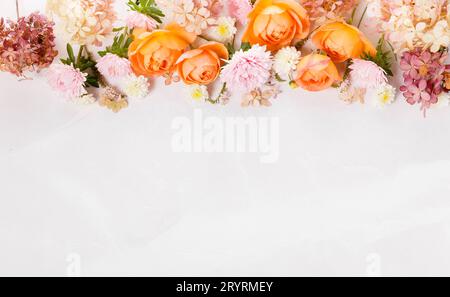 Autumn creative composition roses, hydrangea flowers on gray background. Fall, autumn background. Stock Photo