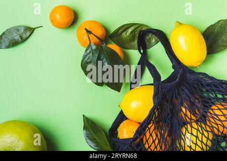 Set of citrus in mesh textile bag. Healthy food and zero waste concept Stock Photo