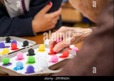 Rehabilitation center. Brain therapy cognitive psychological testing on senior patient. Alzheimer's disease and dementia prevent Stock Photo