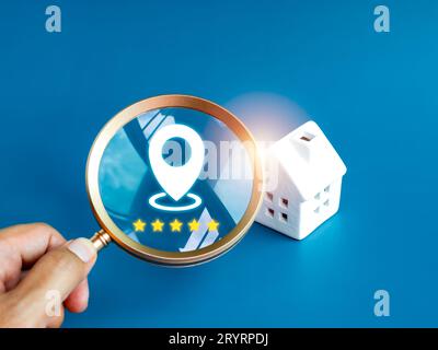 Home searching, choose the best location, house survey, real estate buying or property investment concepts. Location icon with five stars review in ma Stock Photo