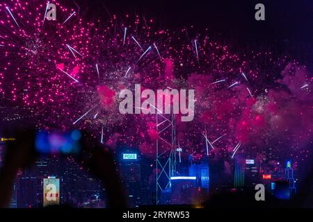 Colurful spectacular fireworks with skyscrapers in the backgrounnd in Hong Kong night view on National Day Stock Photo