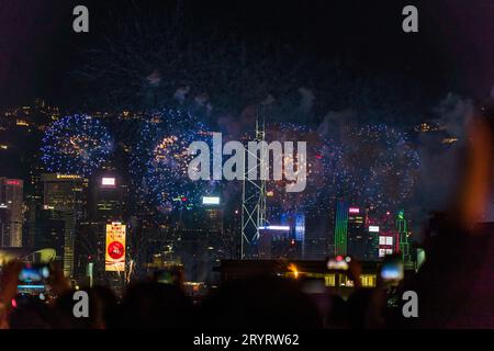 Colurful spectacular fireworks with skyscrapers in the backgrounnd in Hong Kong night view on National Day Stock Photo