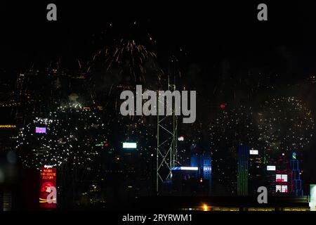 Colurful spectacular fireworks with skyscrapers in the backgrounnd in Hong Kong night view on National Day Stock Photo