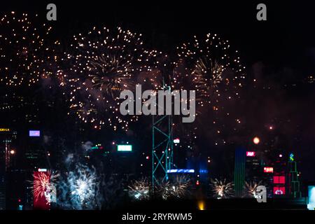 Colurful spectacular fireworks with skyscrapers in the backgrounnd in Hong Kong night view on National Day Stock Photo