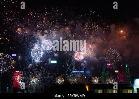 Colurful spectacular fireworks with skyscrapers in the backgrounnd in Hong Kong night view on National Day Stock Photo