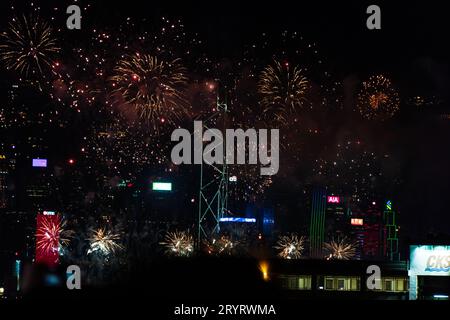 Colurful spectacular fireworks with skyscrapers in the backgrounnd in Hong Kong night view on National Day Stock Photo