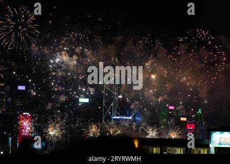 Colurful spectacular fireworks with skyscrapers in the backgrounnd in Hong Kong night view on National Day Stock Photo