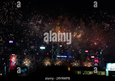 Colurful spectacular fireworks with skyscrapers in the backgrounnd in Hong Kong night view on National Day Stock Photo