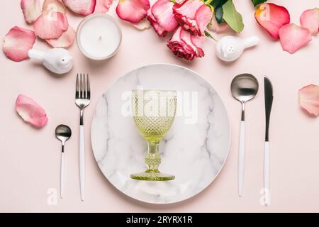 Romantic table setting in pink colors. Tableware and decorations for serving a festive table Stock Photo