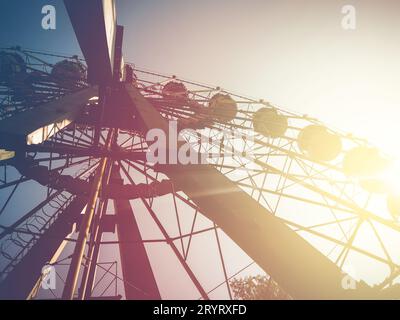 Retro Ferris wheel on a blue sky background, mobile photo Stock Photo