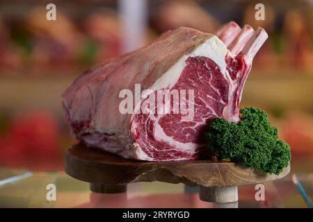 Close Up Of Rib Of Beef On Meat Counter In Butchers Stock Photo
