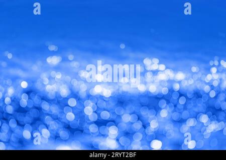 Abstract dark ink blue bokeh background. Defocused cobalt blue lights background. Stock Photo