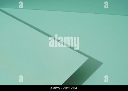 Colorful background from green paper with shadow. Abstract geometric Stock Photo