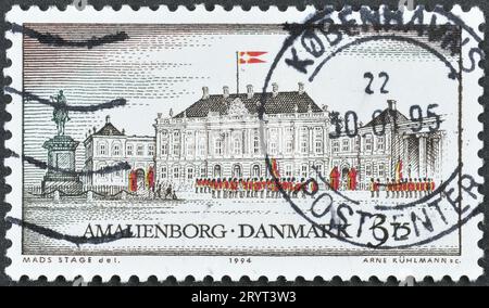 Cancelled postage stamp printed by Denmark, that shows Amalienborg Castle, Copenhagen, circa 1994. Stock Photo