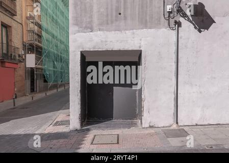 Rear entrance of a nightclub with gray painted metal doors Stock Photo