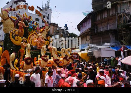 Pune, India - September 29, 2023, Guruji Talim Ganpati, Pune Ganpati Visarjan Procession with The Rhythm of Traditional Dhol Tasha Music. Stock Photo