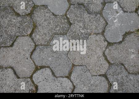 Concrete polygonal tiles. Construction background Stock Photo