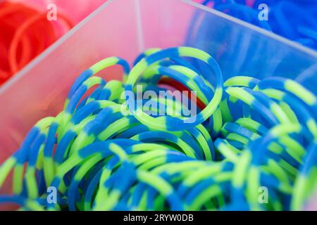 A set of multi-colored elastic bands for weaving bracelets for children. Stock Photo