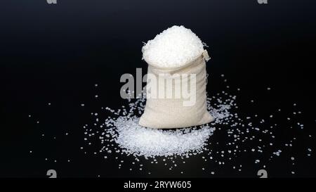 Sweet sugar low poly. Sweet, nutritious, tasty sugar. Refined sugar. Refined sugar in triangulation technique. Raw unrefined organic cane sugar pile a Stock Photo