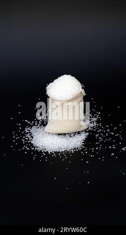 Sweet sugar low poly. Sweet, nutritious, tasty sugar. Refined sugar. Refined sugar in triangulation technique. Raw unrefined organic cane sugar pile a Stock Photo