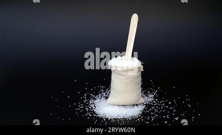 Sweet sugar low poly. Sweet, nutritious, tasty sugar. Refined sugar. Refined sugar in triangulation technique. Raw unrefined organic cane sugar pile a Stock Photo