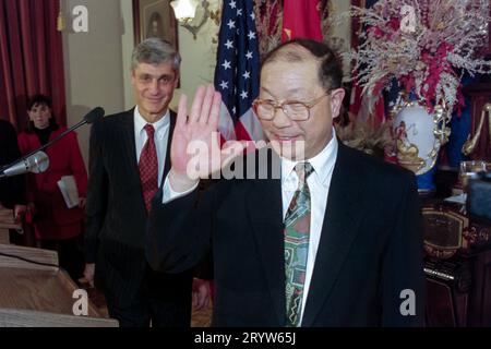 Chinese Finance Minister Liu Zhongli, right, waves goodbye at the end of a joint press conference with U.S. Treasury Secretary Robert Rubin, left, at the Treasury Department, November 19, 1996 in Washington, D.C. Earlier the U.S Export-Import Bank announced long-term loans  for electric power projects in China. Stock Photo