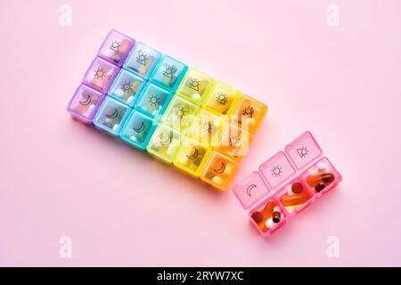 Bright pill box with different pills and vitamins. Stock Photo