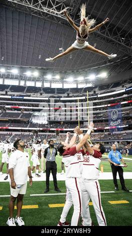 Arlington, Texas, USA. 30th Sep, 2023. University of Arkansas Cheerleader doing a high flip (Credit Image: © Hoss McBain/ZUMA Press Wire) EDITORIAL USAGE ONLY! Not for Commercial USAGE! Stock Photo