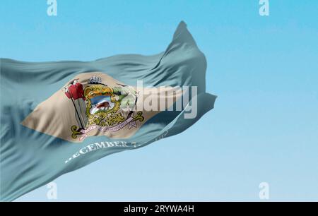 Delaware state flag waving on a clear day. Colonial blue background ...