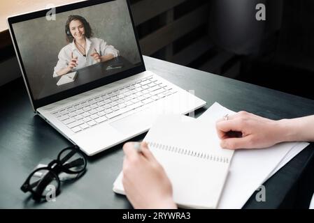 Online Meeting and Collaboration. Woman Engages in Discussion, Work from Home, Freelance, Video Conferencing, Distance Education, and Online Dating Stock Photo