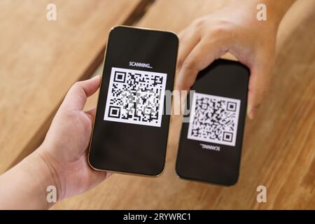 Qr code payment. E wallet. Man scanning tag accepted generate digital pay without money.scanning QR code online shopping cashles Stock Photo