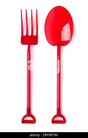 Disposable plastic fork and spoon in the form of a garden fork and shovel isolated on a white background Stock Photo