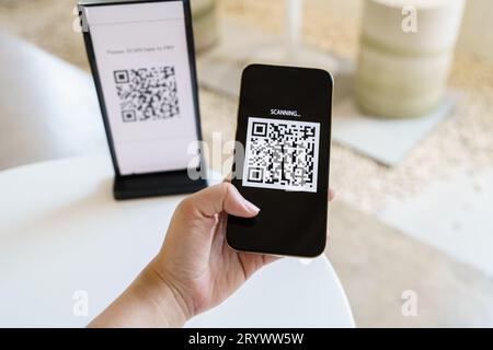 Qr code payment. E wallet. Man scanning tag accepted generate digital pay without money.scanning QR code online shopping cashles Stock Photo