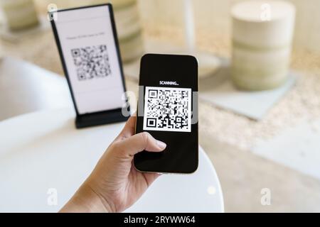 Qr code payment. E wallet. Man scanning tag accepted generate digital pay without money.scanning QR code online shopping cashles Stock Photo