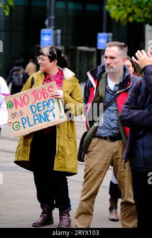 Manchester, UK. 6th Nov 2022. People gather for the Global Day for Climate Justice to promote climate change and to protest against the lack of action Stock Photo