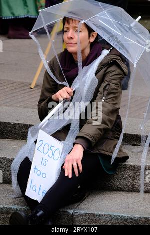 Manchester, UK. 6th Nov 2022. People gather for the Global Day for Climate Justice to promote climate change and to protest against the lack of action Stock Photo