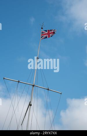 British national flag against blue sky Stock Photo - Alamy