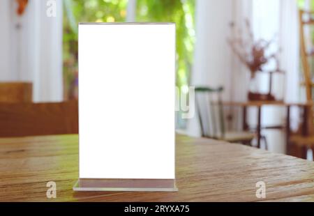 Mock up Menu frame standing on wood table in Bar restaurant cafe. space for text Stock Photo