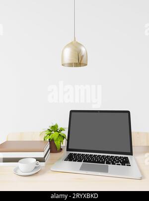 Mock up Laptop Screen on work table in office or in the house Stock Photo