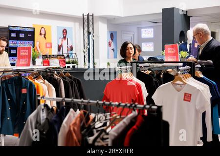 Diverse people customers shopping in fashion outlet on Black