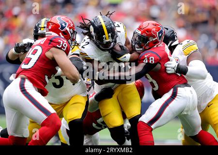 Houston, Texas, USA. 1st Oct, 2023. Pittsburgh Steelers running back Najee Harris (22) is tackled by Houston Texans linebacker Christian Harris (48) whill carrying the ball during the game between between the Houston Texans and the Pittsburgh Steelers at NRG Stadium in Houston, TX on October 1, 2023. (Credit Image: © Erik Williams/ZUMA Press Wire) EDITORIAL USAGE ONLY! Not for Commercial USAGE! Stock Photo
